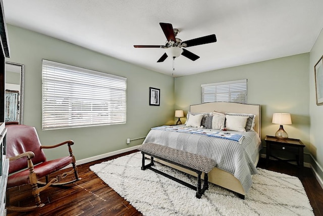 bedroom featuring dark hardwood / wood-style floors and ceiling fan