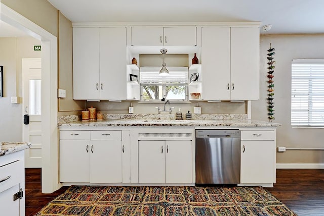 kitchen featuring pendant lighting, dishwasher, sink, dark hardwood / wood-style flooring, and white cabinetry