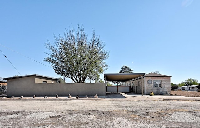 exterior space featuring a carport