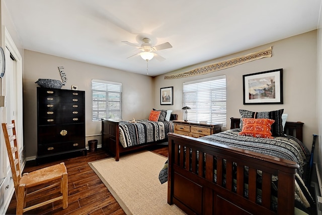 bedroom featuring a closet, dark hardwood / wood-style floors, and ceiling fan