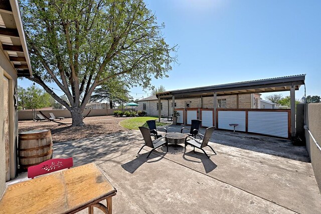 view of patio with an outdoor fire pit