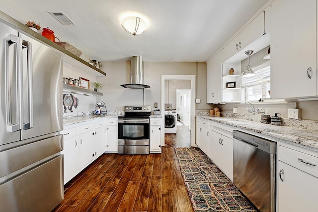 kitchen featuring dark hardwood / wood-style flooring, stainless steel appliances, exhaust hood, decorative light fixtures, and white cabinets