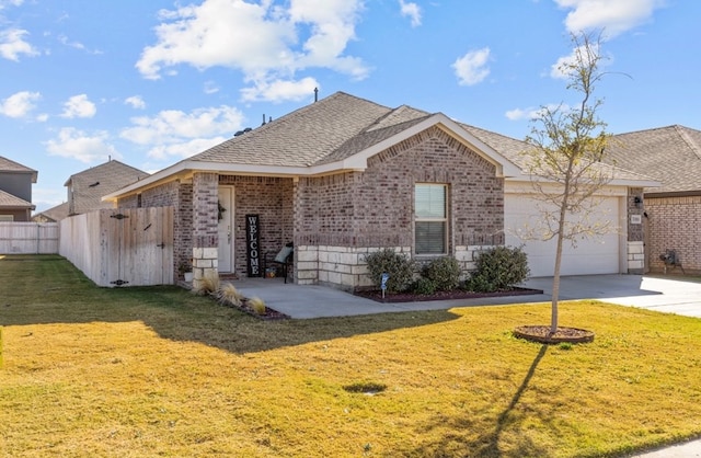 7018 Adenium Rd, Odessa, TX 79765 - view of front of property with brick siding, a garage, roof with shingles, and concrete driveway