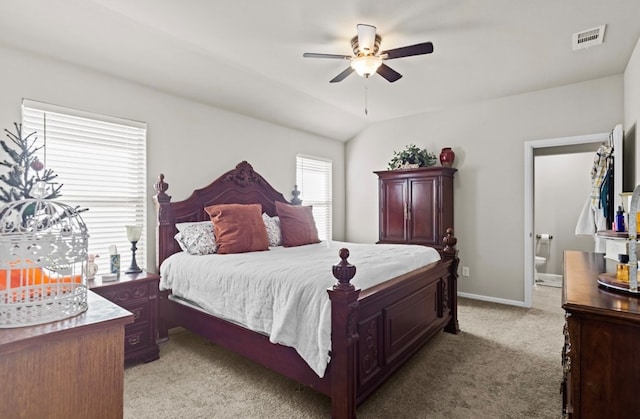 7018 Adenium Rd, Odessa, TX 79765 - bedroom with light colored carpet, ensuite bath, vaulted ceiling, and a ceiling fan
