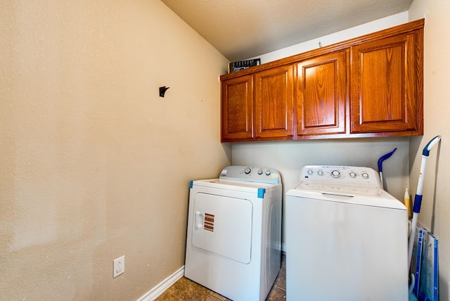 8625 Harvard Ave, Odessa, TX 79765 - laundry area featuring cabinet space, washer and clothes dryer, and tile patterned floors