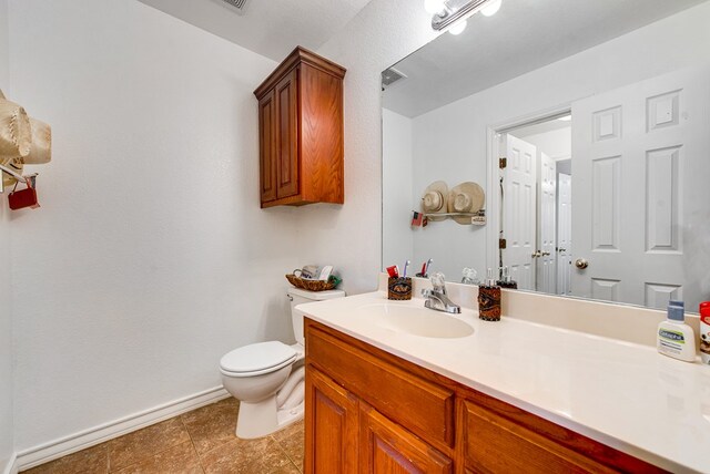 8625 Harvard Ave, Odessa, TX 79765 - bathroom with toilet and vanity