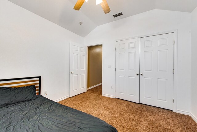 8625 Harvard Ave, Odessa, TX 79765 - carpeted bedroom with vaulted ceiling, a ceiling fan, and a closet