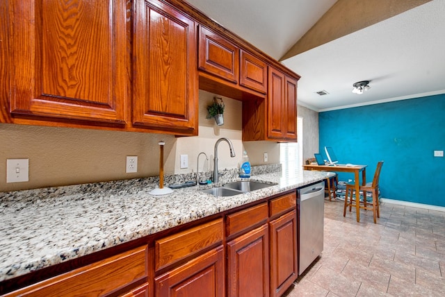 8625 Harvard Ave, Odessa, TX 79765 - kitchen with stainless steel dishwasher, light stone counters, light stone finish flooring, lofted ceiling, and brown cabinets