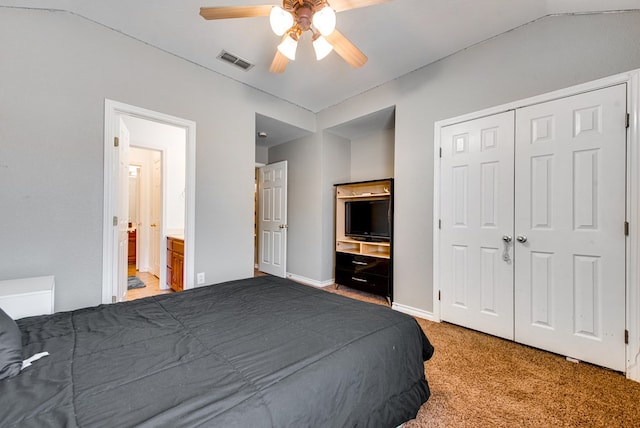 8625 Harvard Ave, Odessa, TX 79765 - bedroom with light carpet, ensuite bath, a ceiling fan, and a closet
