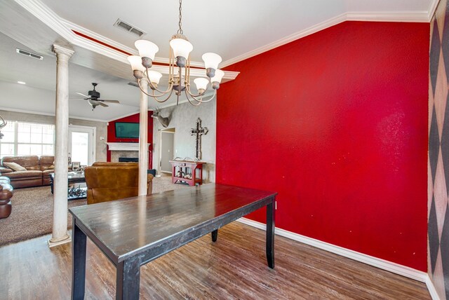 8625 Harvard Ave, Odessa, TX 79765 - dining area with ceiling fan, decorative columns, wood finished floors, crown molding, and a chandelier