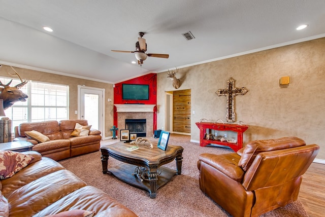 8625 Harvard Ave, Odessa, TX 79765 - living room with ceiling fan, ornamental molding, a tiled fireplace, and lofted ceiling