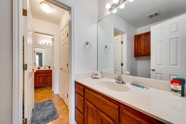 8625 Harvard Ave, Odessa, TX 79765 - bathroom with vanity and tile patterned floors