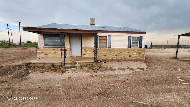 341 Bass St, Crane, TX 79731 - view of front of home with brick siding and covered porch
