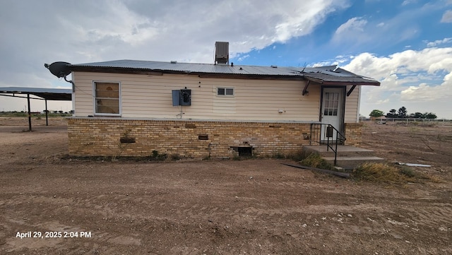 341 Bass St, Crane, TX 79731 - rear view of house with brick siding and metal roof
