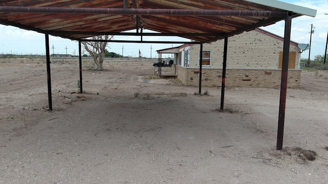341 Bass St, Crane, TX 79731 - view of patio / terrace with a carport