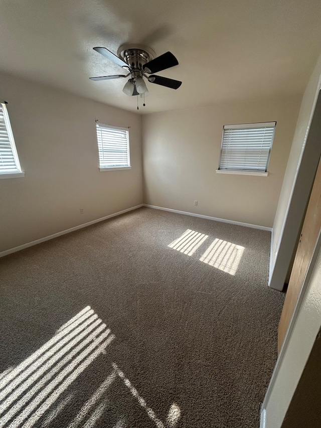 1712 Nabors Ln, Odessa, TX 79761 - carpeted spare room with a ceiling fan and baseboards
