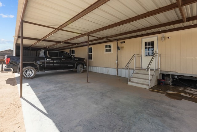 exterior space with an attached carport and entry steps