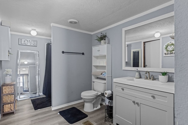 bathroom featuring crown molding, toilet, and wood finished floors