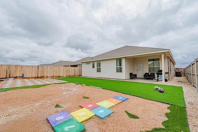6205 Globe Life Ct, Odessa, TX 79762 - rear view of property with a fenced backyard, a patio, and roof with shingles