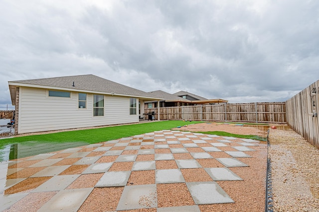 6205 Globe Life Ct, Odessa, TX 79762 - fenced backyard with a patio area