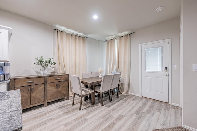 6205 Globe Life Ct, Odessa, TX 79762 - dining area with light wood-type flooring and baseboards
