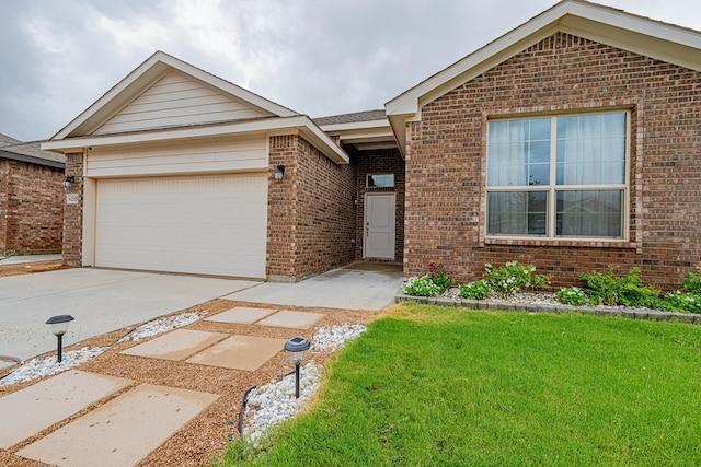 6205 Globe Life Ct, Odessa, TX 79762 - single story home with brick siding, an attached garage, concrete driveway, and a front yard