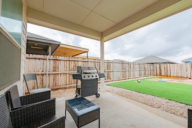 6205 Globe Life Ct, Odessa, TX 79762 - fenced backyard featuring a grill and a patio
