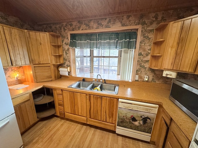 101 Stage Coach Pass, Fort Davis, TX 79734 - kitchen with dishwasher, open shelves, stainless steel microwave, light wood-style flooring, and light countertops