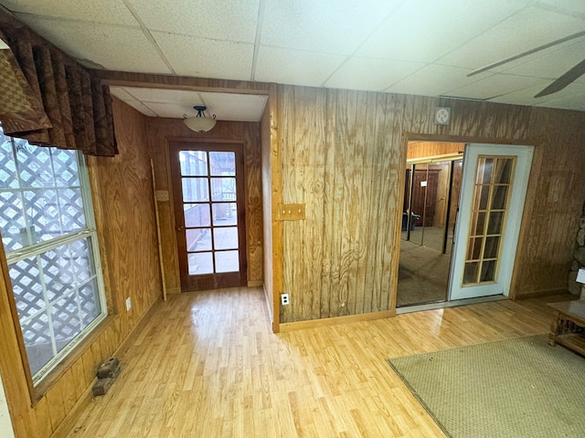 101 Stage Coach Pass, Fort Davis, TX 79734 - doorway with a paneled ceiling, wood finished floors, and wood walls