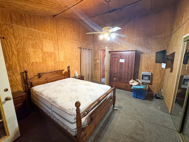 101 Stage Coach Pass, Fort Davis, TX 79734 - carpeted bedroom featuring wooden ceiling, heating unit, wood walls, vaulted ceiling, and ceiling fan
