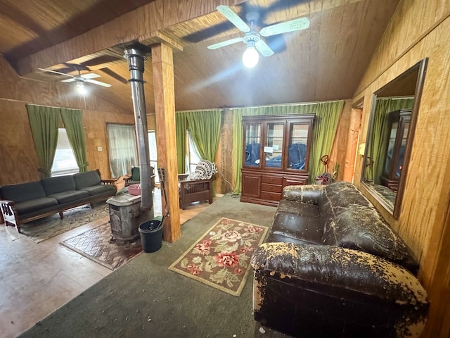 101 Stage Coach Pass, Fort Davis, TX 79734 - living area with ceiling fan, vaulted ceiling, wooden walls, a wood stove, and wooden ceiling