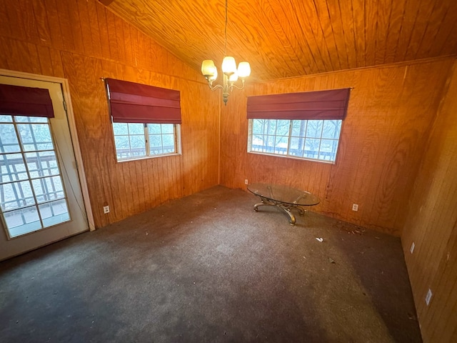 101 Stage Coach Pass, Fort Davis, TX 79734 - carpeted spare room with healthy amount of natural light, a chandelier, wood walls, wood ceiling, and vaulted ceiling