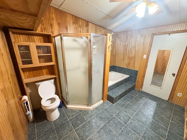 101 Stage Coach Pass, Fort Davis, TX 79734 - full bath with wooden walls, a garden tub, a stall shower, tile patterned floors, and ceiling fan