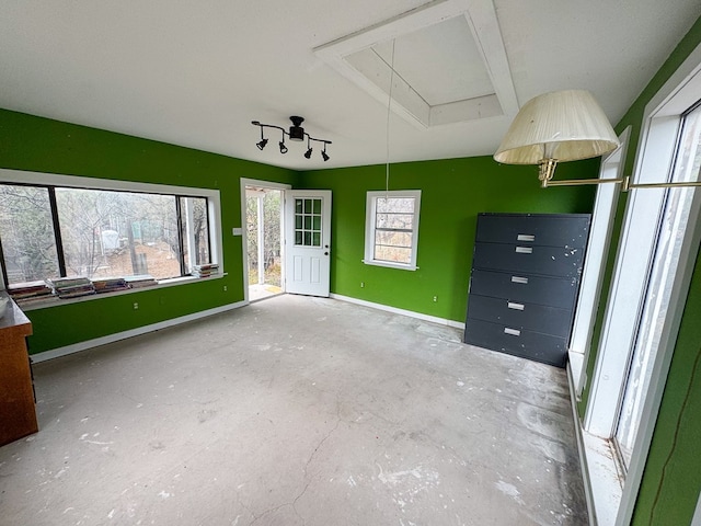 101 Stage Coach Pass, Fort Davis, TX 79734 - unfurnished living room with attic access and unfinished concrete floors