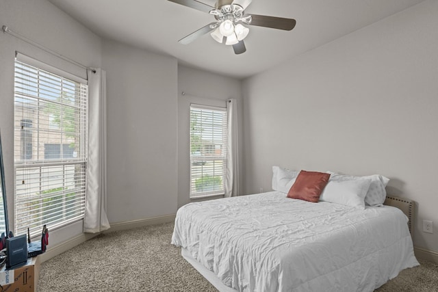 bedroom featuring baseboards, ceiling fan, and carpet floors