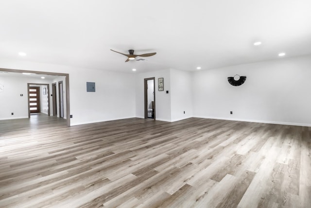 unfurnished living room with recessed lighting, ceiling fan, and wood finished floors