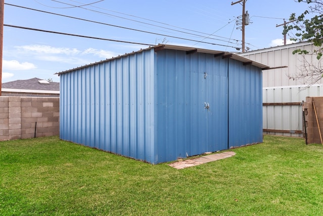 view of shed with fence private yard