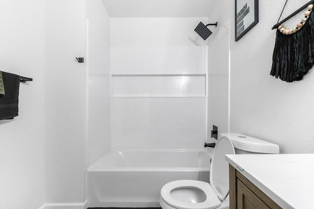 bathroom with vanity, washtub / shower combination, and toilet