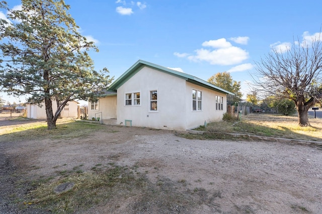 308 N 10th St, Alpine, TX 79830 - view of property exterior with fence and stucco siding