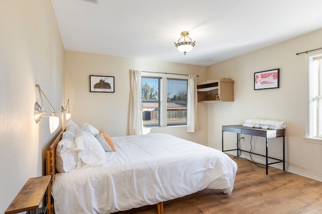 308 N 10th St, Alpine, TX 79830 - bedroom featuring wood finished floors and baseboards