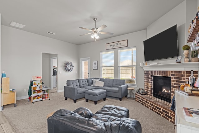 1215 E 93rd St, Odessa, TX 79765 - carpeted living area with a brick fireplace, ceiling fan, and baseboards