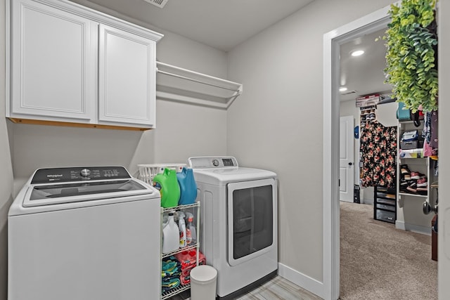 1215 E 93rd St, Odessa, TX 79765 - laundry room with washing machine and dryer, cabinet space, light carpet, and baseboards