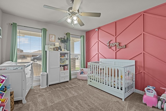 1215 E 93rd St, Odessa, TX 79765 - carpeted bedroom featuring a nursery area and a ceiling fan