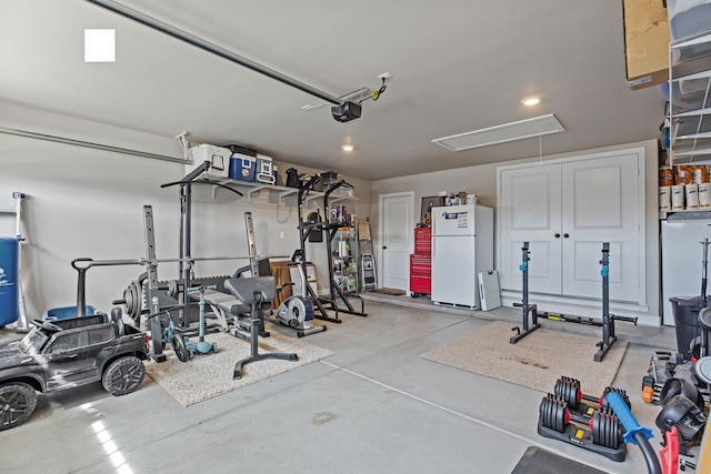 1215 E 93rd St, Odessa, TX 79765 - exercise room featuring attic access, a garage, and recessed lighting