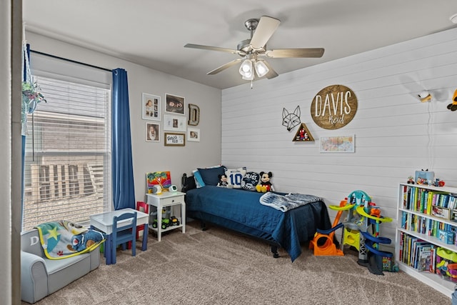 1215 E 93rd St, Odessa, TX 79765 - carpeted bedroom featuring wooden walls and ceiling fan