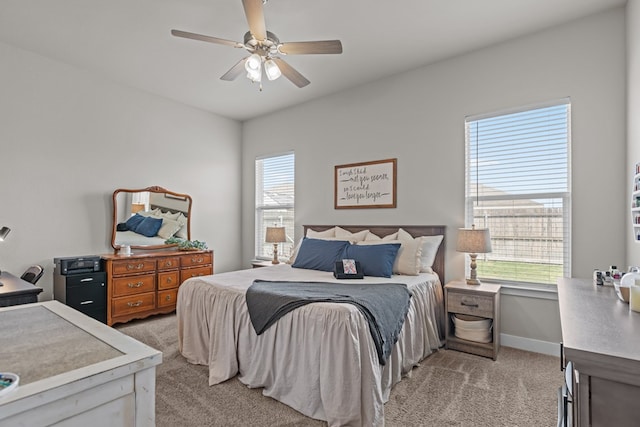 1215 E 93rd St, Odessa, TX 79765 - bedroom featuring light colored carpet, a ceiling fan, and baseboards