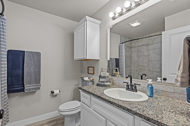 1215 E 93rd St, Odessa, TX 79765 - bathroom featuring baseboards, wood finished floors, toilet, a shower with curtain, and vanity