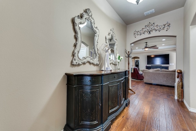 7302 Giotto St, Odessa, TX 79765 - hall featuring arched walkways, wood-type flooring, baseboards, and recessed lighting