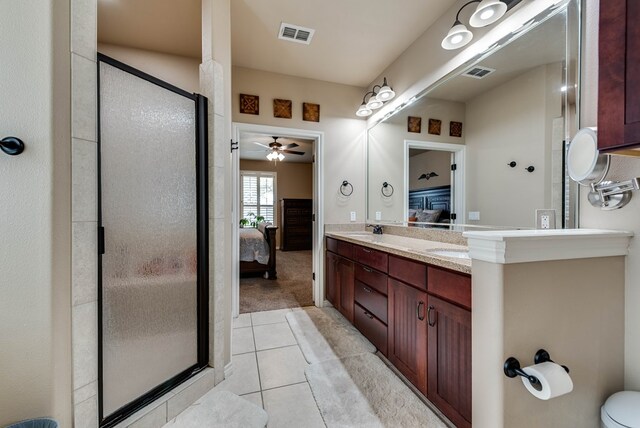 7302 Giotto St, Odessa, TX 79765 - full bath with ensuite bathroom, double vanity, a shower stall, and tile patterned floors