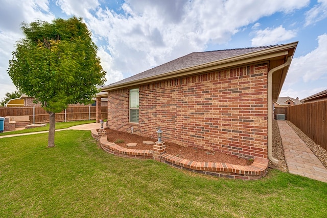 7302 Giotto St, Odessa, TX 79765 - view of side of property with brick siding and a patio